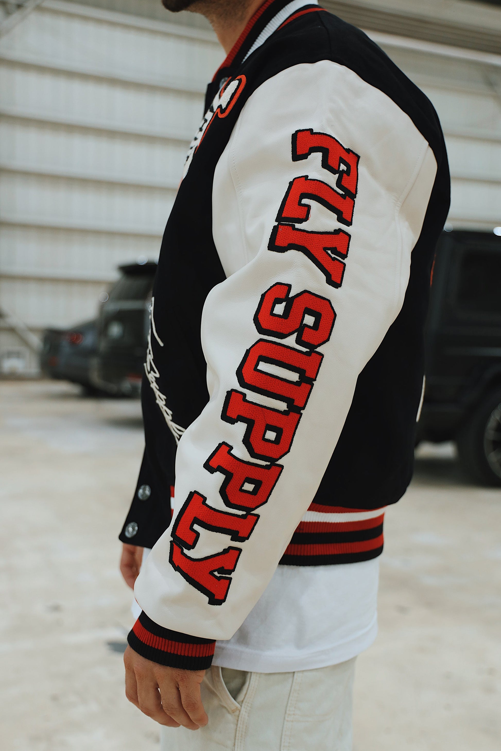 Manifest Varsity Jacket (Black) - RUN THE STREETS COLLABORATIVE
