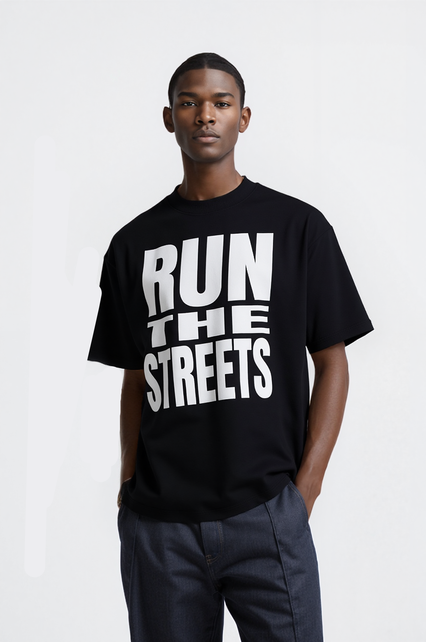 Man wearing a black t-shirt with 'RUN THE STREETS' text on a white background