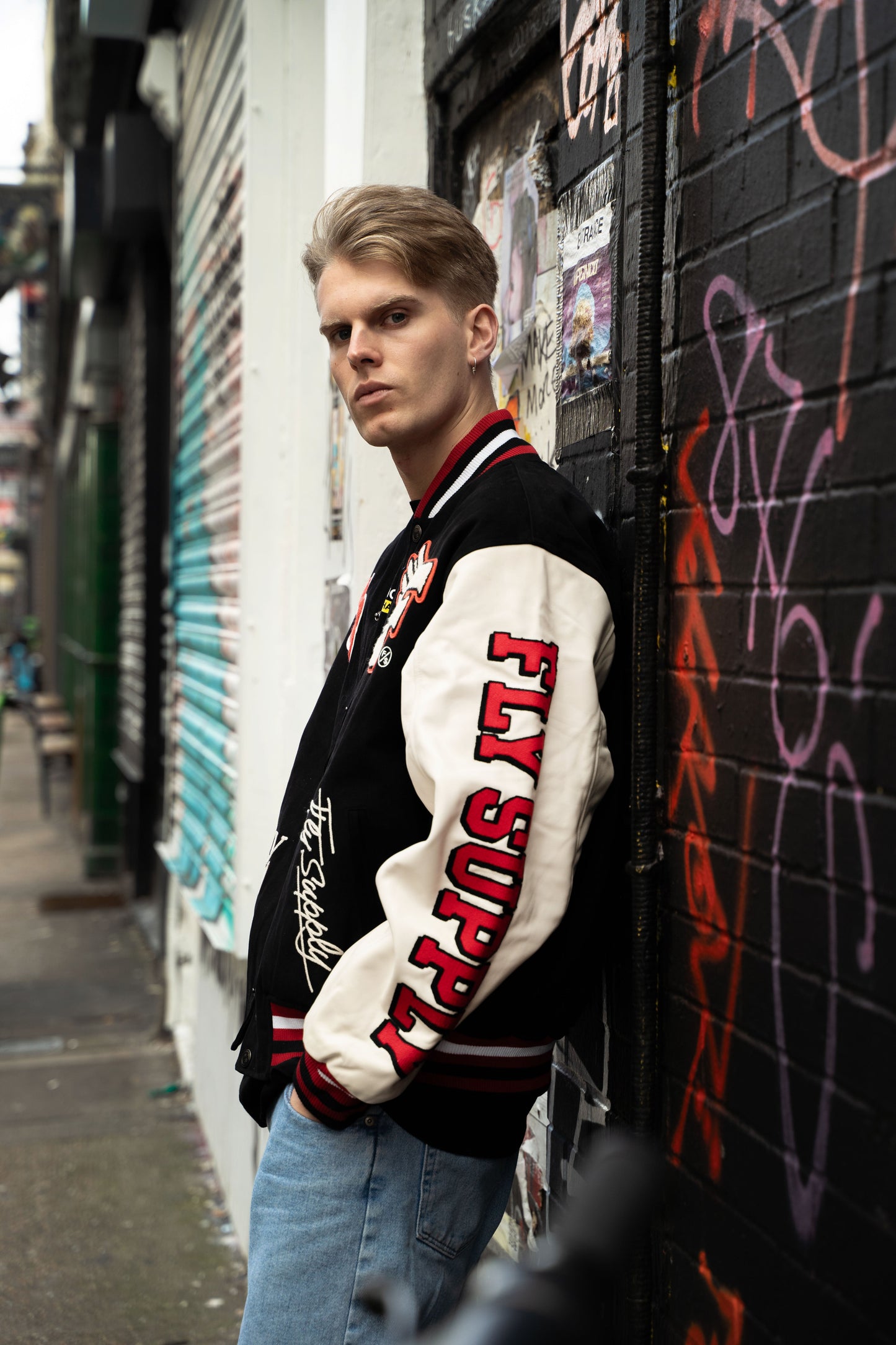 Manifest Varsity Jacket (Black) - RUN THE STREETS COLLABORATIVE