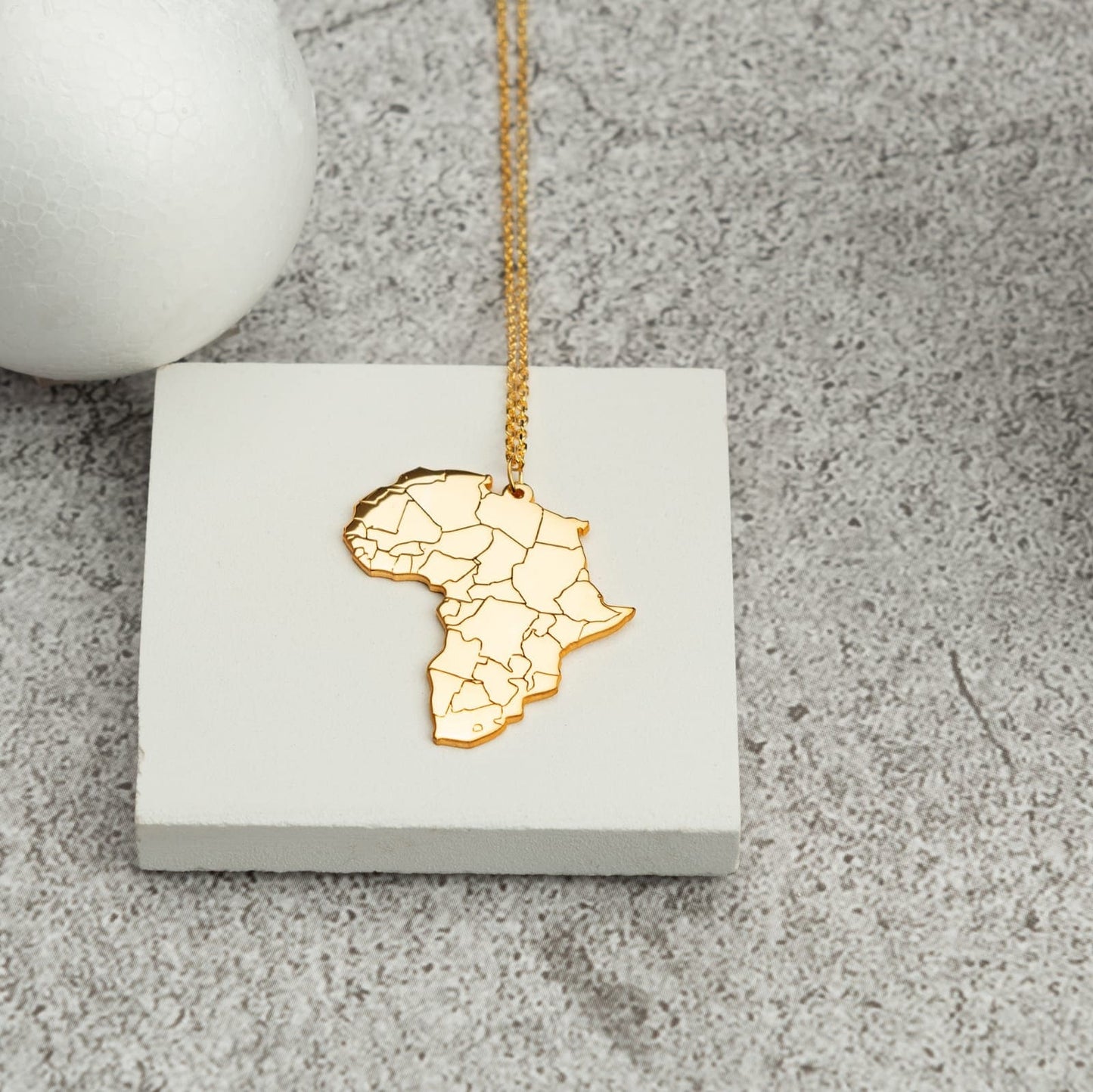 Africa Map Necklace - RUN THE STREETS COLLABORATIVE