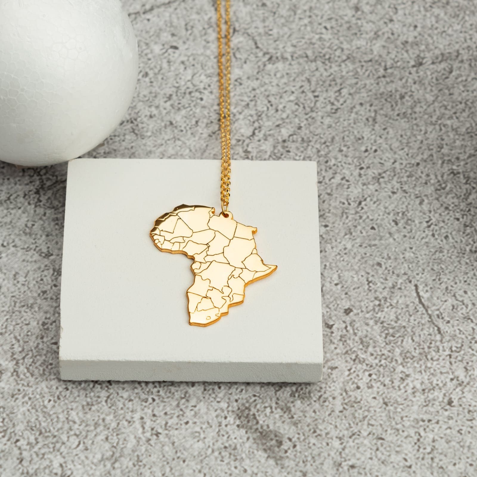 Africa Map Necklace - RUN THE STREETS COLLABORATIVE