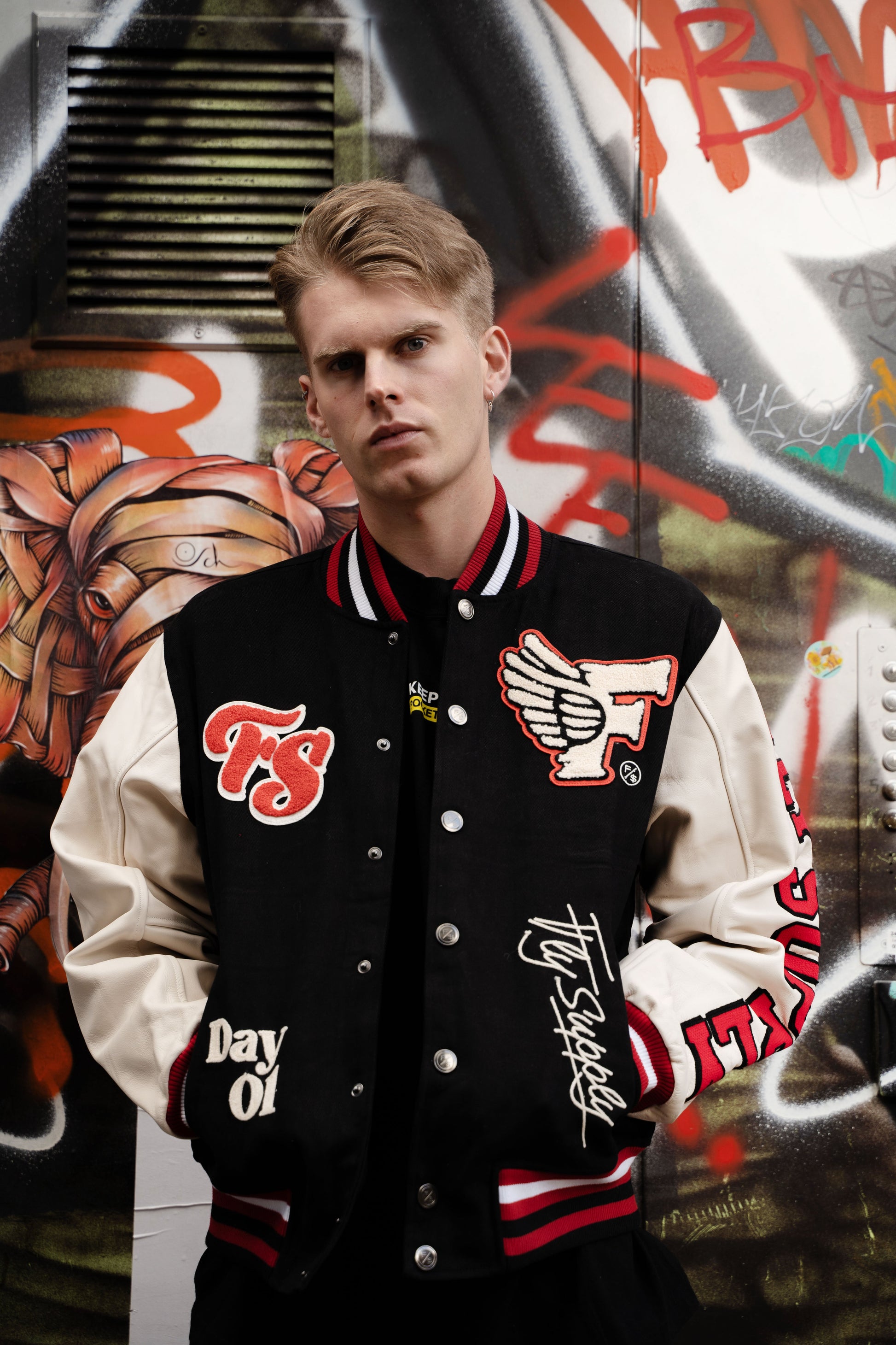 Manifest Varsity Jacket (Black) - RUN THE STREETS COLLABORATIVE